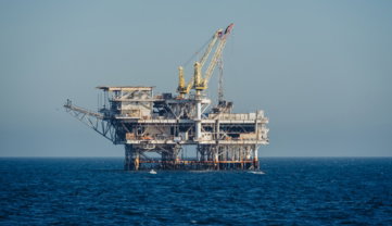 an-oil-rig-in-the-middle-of-the-ocean.jpg An oil rig in the middle of the ocean