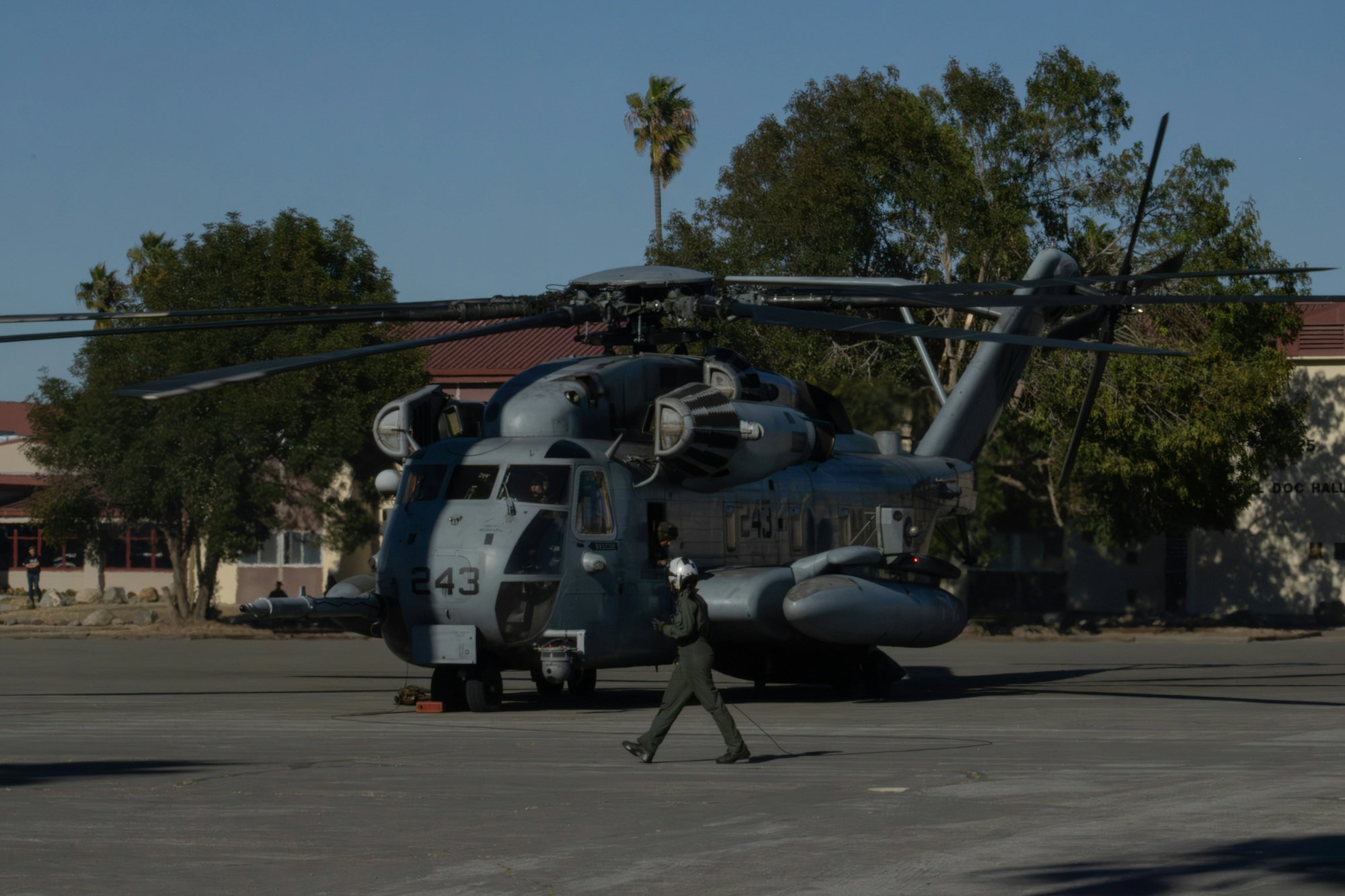 A large military helicopter parked on tarmac